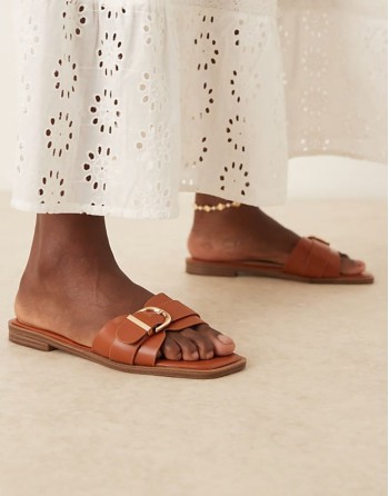 Nikola buckle flat sandals in tan