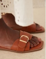 Nikola buckle flat sandals in tan